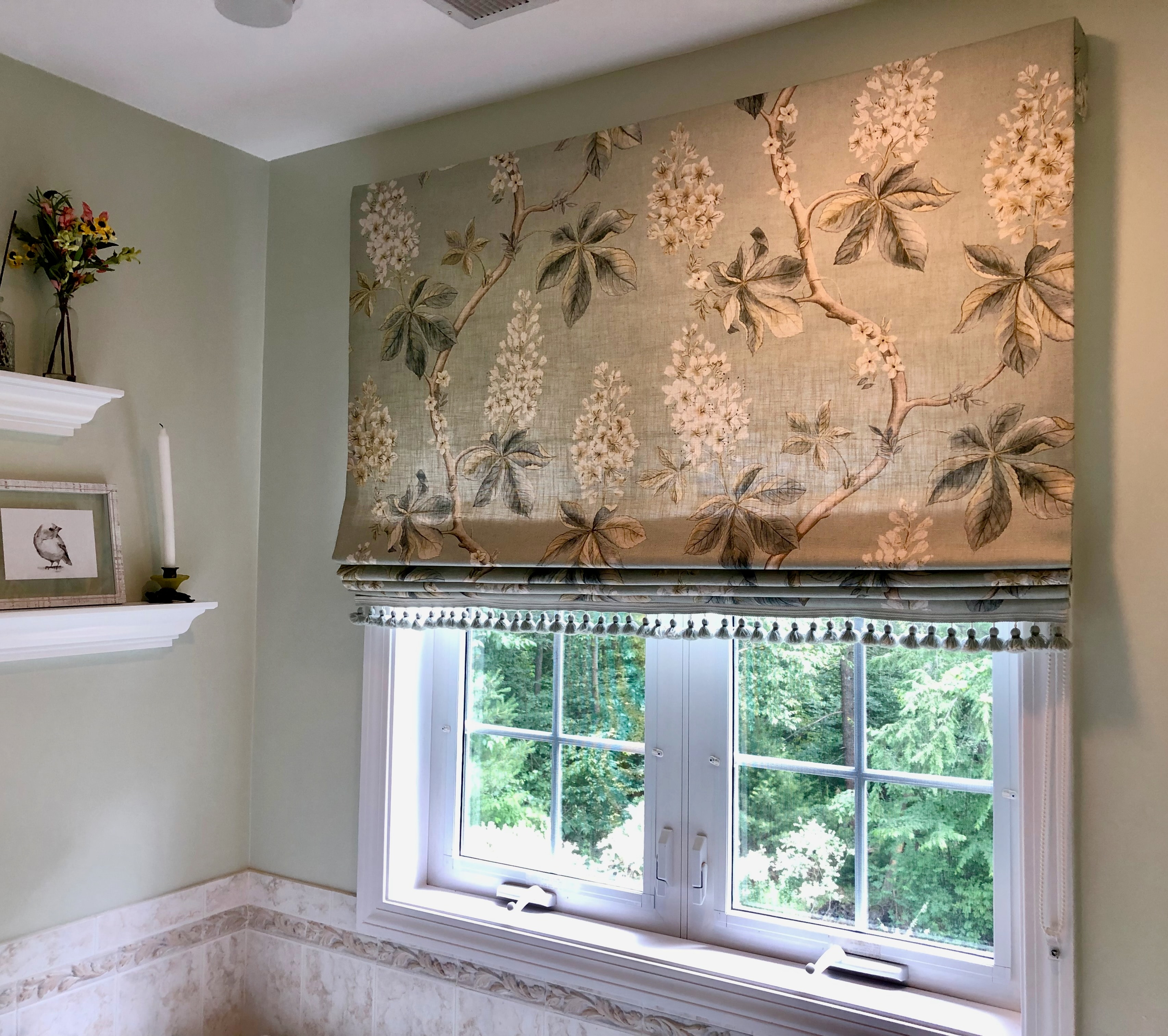 Botanical wallpaper above bathroom window shade